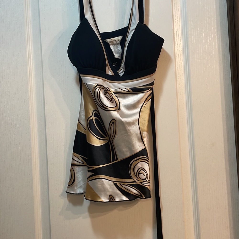 A small, Speechless brandes tanktop. Colors of black, bronze, and white.